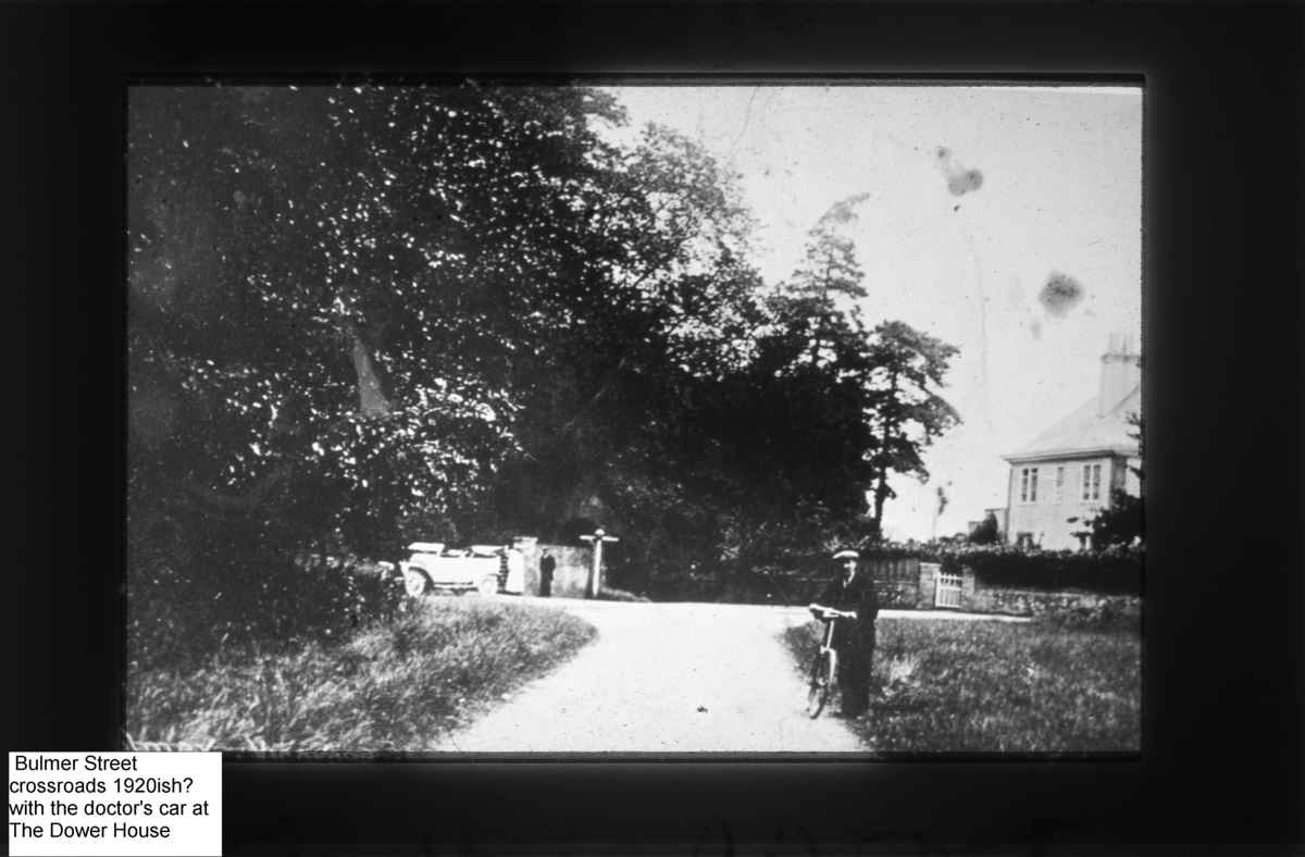 Cross roads 1920ish with old car